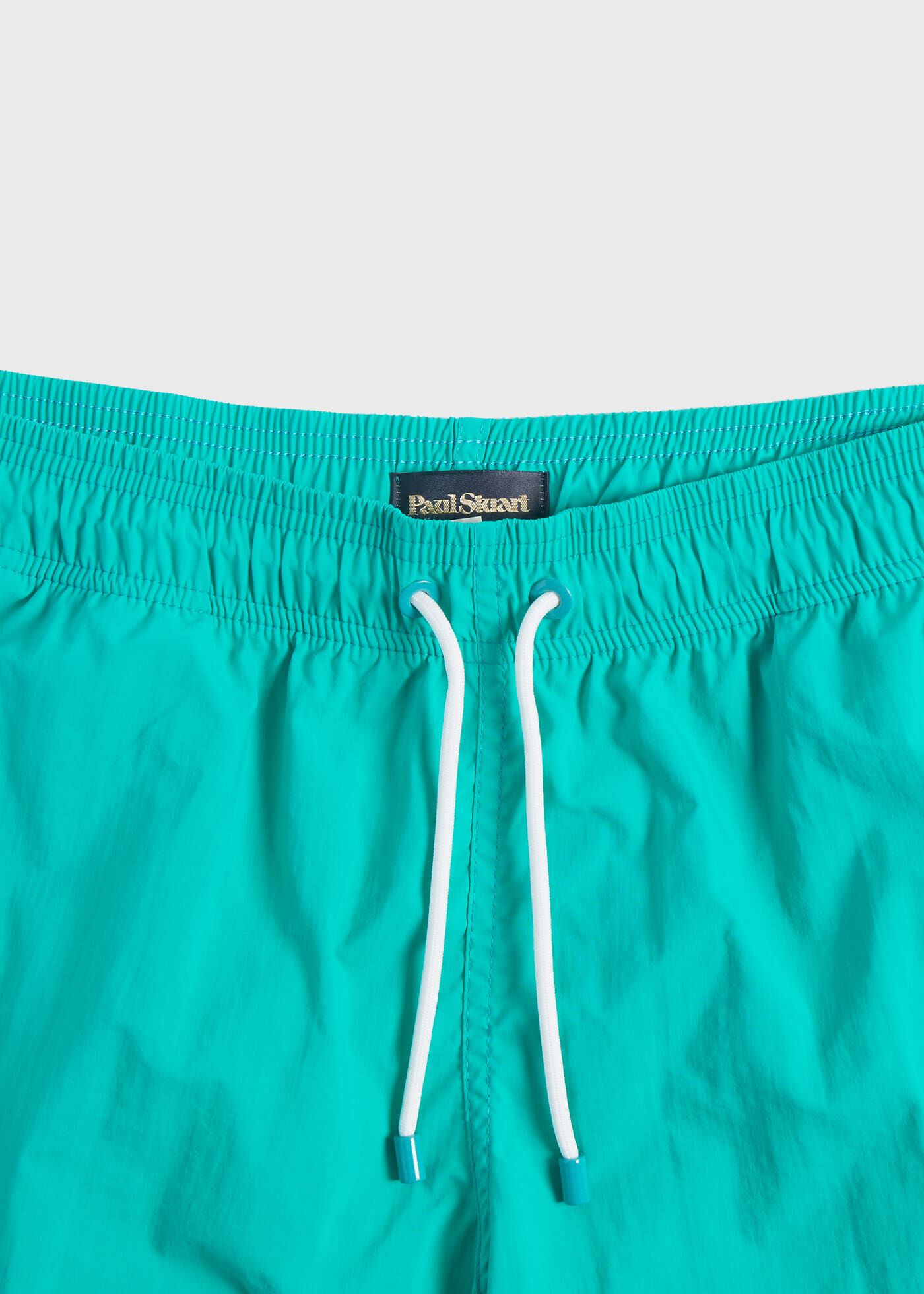 Solid color swim trunks top